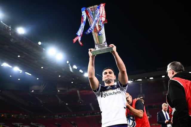 Wakefield Trinity's Jack Sinfield with the Super League trophy following the Grand Final win against Warrington Wolves. Picture by Olly Hassell/SWpix.com.