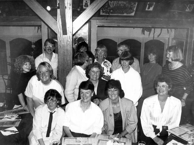 A group portrait of staff and local residents of Alston Lane centre on the occasion of a farewell party for the central organiser, Faye White, seen in the centre. She had worked as the central organiser for four years but prior to that she had five years experience as a schools social worker attached to Seacroft Park, Foxwood and Parklands Schools. She had also spent four years with the Family Service Unit in Seacroft. Pictured in November 1987.