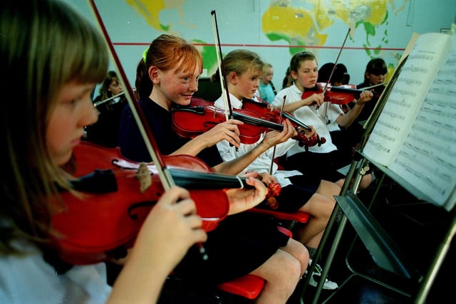 Four members of the orchestra at Ninelands Lane Primary School in Septwember 1997. Pictured, from left, are Kirsty Winter, Lisa Llewellyn, Laura Pritchard and Eleanor Leatham.