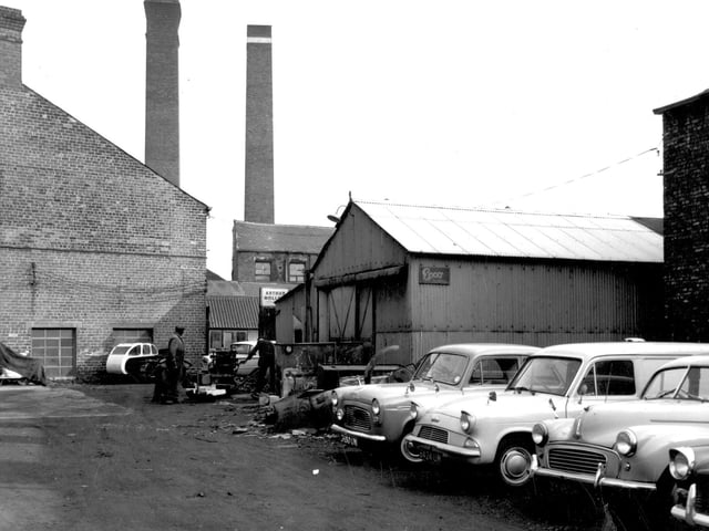 A yard off Skinner Lane pictured in September 1964. In the background are the premises of Arthur Mollett Woodcraft, chair frame makers listed as number 69 Skinner Lane. The corrugated iron building in the centre has an 'Epco Ltd' sign on the side. This firm were motorcar accessory manufacturers.