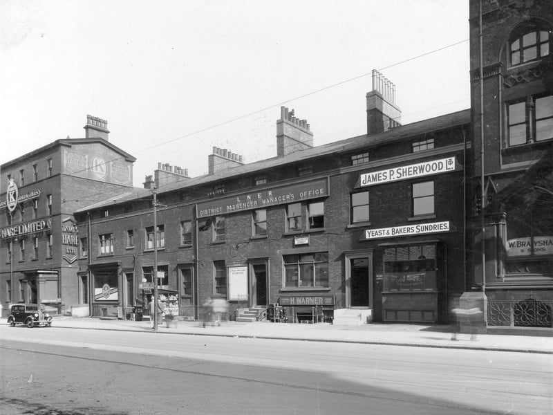Wellington Street in August 1937. From the left, is no.72 James Hare woollen warehouse, no.68A Ellis Noble, barber also newsagents kiosk. London and North Eastern Railway Office (LNER) occupies centre of block, no.64. John Allix was office manager. No.62, business of Henry Warner suitcase maker. James P Sherwood yeast supplier was at no.60. These properties still exist.