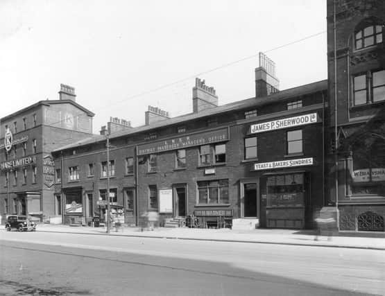 Wellington Street in August 1937. From the left, is no.72 James Hare woollen warehouse, no.68A Ellis Noble, barber also newsagents kiosk. London and North Eastern Railway Office (LNER) occupies centre of block, no.64. John Allix was office manager. No.62, business of Henry Warner suitcase maker. James P Sherwood yeast supplier was at no.60. These properties still exist.