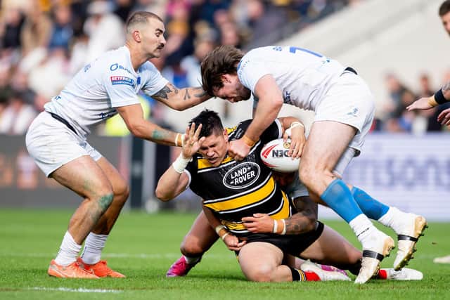 York Knights' Mitch Clark is tackled by Mathieu Jussaume and Joe Bretherton, of Toulouse Olympique, during last year's Betfred Championship Grand Final. Picture by Allan McKenzie/SWpix.com.