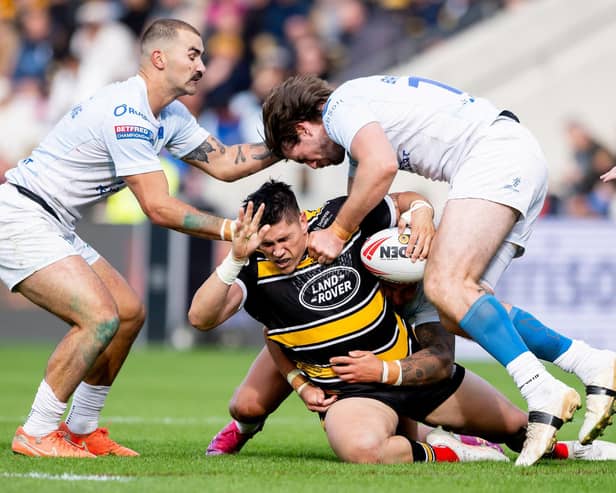 York Knights' Mitch Clark is tackled by Mathieu Jussaume and Joe Bretherton, of Toulouse Olympique, during last year's Betfred Championship Grand Final. Picture by Allan McKenzie/SWpix.com.