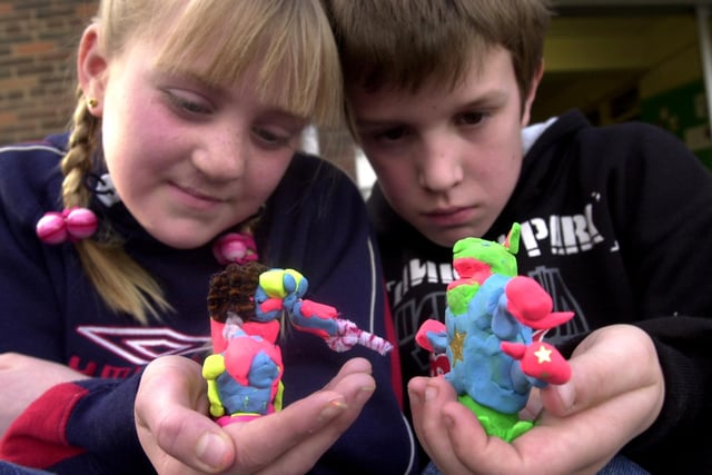 Cousins Kennedy Elwen and Joe Brooke with their monster models made for an animation workshop at Crossgates Library in April 2002.