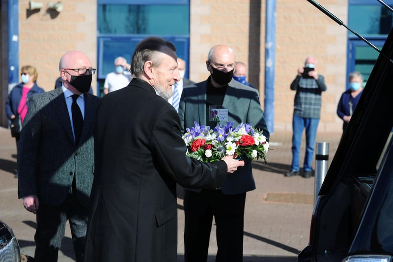 A wreath is placed in the hearse by Alex Totten and club chairman, Gary Deans (Pic: Michael Gillen)