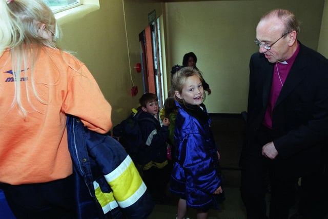 The Archbishop of York, Dr David Hope, meets pupils at Whitebridge Primary School on Halton Moor estate in May 1999.