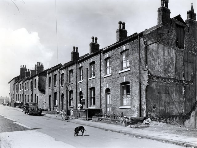 Looking up Glover Street towards Camp Road, which is on the left. Glover Street begins here with number 1, moving right numbers follow in sequence to 19 on the right. Just visible on Camp Road are some of the new council maisonettes, built on the site previously occupied by Victoria Place. This side of Camp Road was included in an earlier phase of redevelopment and had been cleared in the early 1950s. Pictured in July 1958.