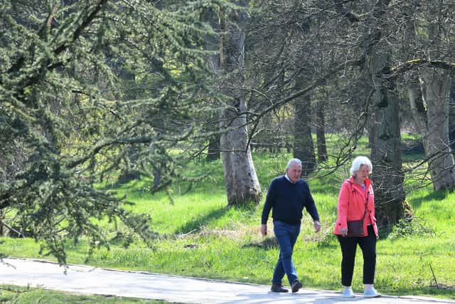 Visitors to Golden Acre Park in Leeds enjoying a walk in the spring sunshine. Photo: Gary Longbottom