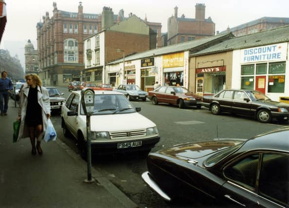 George Street looking in the direction of Ludgate Hill and Vicar Lane. The red brick building at the left edge once housed the department store, Willis Ludlow's. The tall white rendered building is the Market Tavern of number 1 George Street, which stands at the junction with Harewood Street.