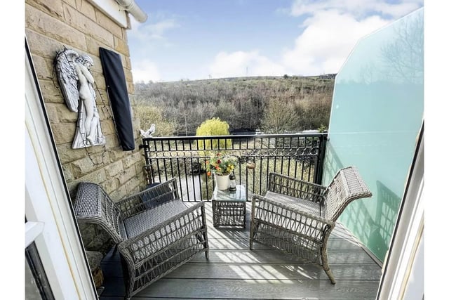 A balcony with river views from this first floor flat in Sowerby Bridge.