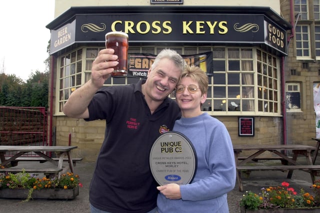 Andy Tatum and Trisha Sperin of the Cross Keys toast success after winning a Pub of the Year award in October 2002.
