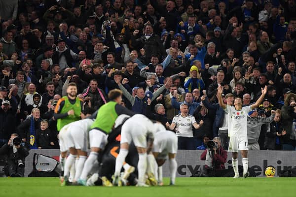 Leeds United's players and fans celebrate Crysencio Summerville's winner - but the Whites had earlier looked dead and burried.
