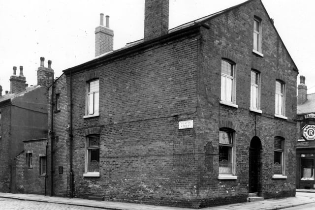 The Beulah Inn as seen from the corner of Purton Street (left) and Galway Street (right). The frontage of the Beulah Inn is on Galway Street and it has decorative windows with leaded patterns and etched glass. Beyond far right is a glimpse of Bewerley Street. Pictured in June 1964.