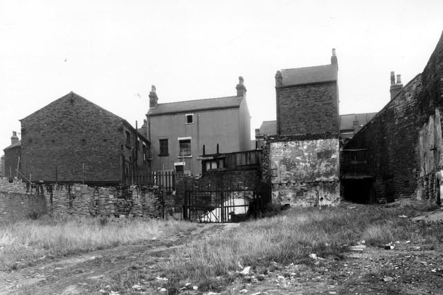 On the left here was Smith's Court. The centre of the view looked to the rear of Dairy Street. Holroyds Yard is to the right. The cleared area in the foreground had been White Rose Yard. Pictured in September 1959.