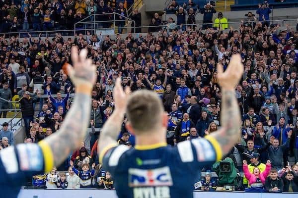 Rhinos fans and players, led by Richie Myler, celebrate the win over Huddersfield. Picture by Allan McKenzie/SWpix.com.