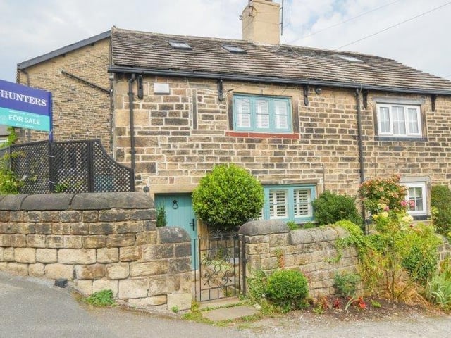 This beautiful stone-built cottage, located in the heart of Calverley village is on the market for £310,000.