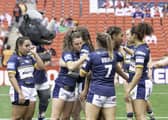 Leeds console themselves after defeat to St Helens. (Photo: Allan McKenzie/SWpix.com)