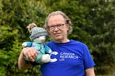 Chris Prow is climbing the equivalent height of Everest in memory of his wife who died of cancer with a teddy bear made from her wedding dress. Picture: Simon Hulme