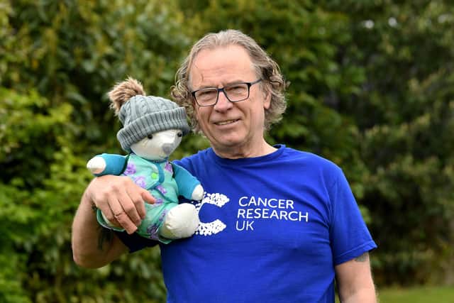 Chris Prow is climbing the equivalent height of Everest in memory of his wife who died of cancer with a teddy bear made from her wedding dress. Picture: Simon Hulme