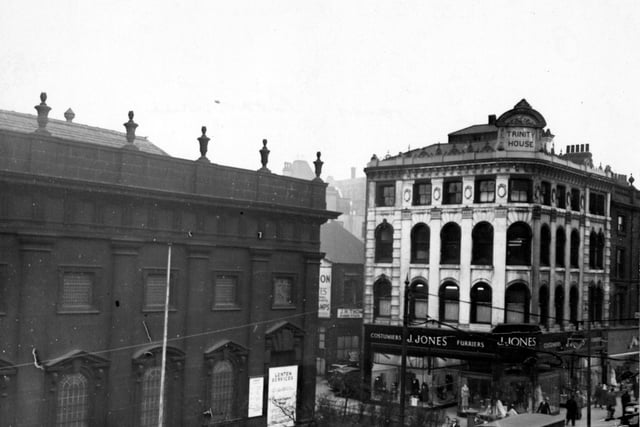 An elevated view of Boar Lane, showing Holy Trinity Church on the left and J. Jones, furriers, on the right. This building has the name Trinity House on a plaque on the roof corner; whether the building originally had any connection to Holy Trinity Church, or was just so named because it was next to it, is unclear at present.