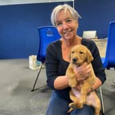 Janet Dyson with trainee support  dog Frank as a pup