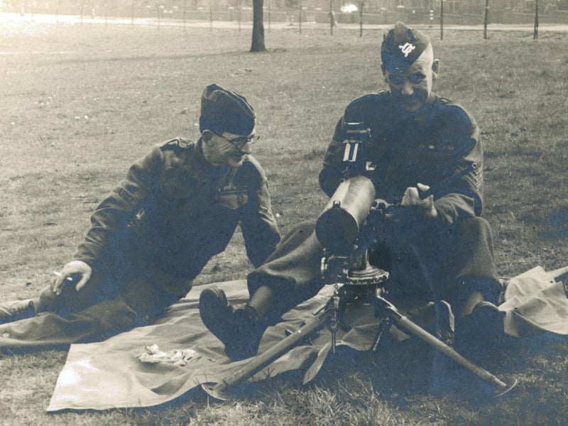 This image is entitled 'A Demonstration of Stripping by an Expert?' and shows men stripping and cleaning a Browning Machine Gun, probably in Becketts Park. Becketts Park in Headingley was used as a training centre during WWII, mostly for training medical orderlies.