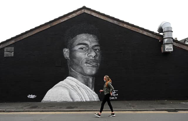 (A mural by grafitti artist Akse P19 of Manchester United football player Marcus Rashford - Photo by PAUL ELLIS/AFP via Getty Images)