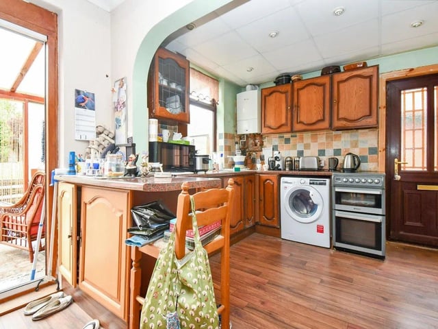The kitchen, though in need of modernization, offers a great opportunity to create a bespoke cooking and dining space.
