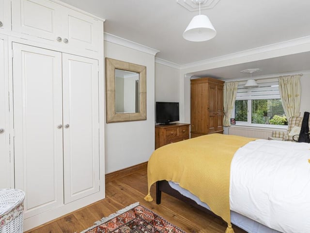 One of four individually styled bedrooms in the property.