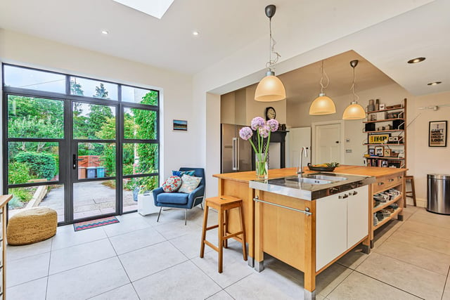 At the heart of the home is the generously sized dining kitchen with a roof lantern, free standing wall and base units, underfloor heating, porcelain tiled flooring and a stunning wood burning stove.