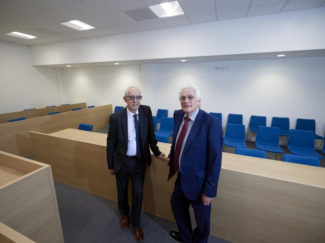Kevin McLoughlin, senior coroner for West Yorkshire eastern coroner’s service, left, and Les Shaw, Wakefield Council's cabinet member for resources and property, stand inside the main coroner's court at Mulberry House, Merchant Gate, Wakefield.