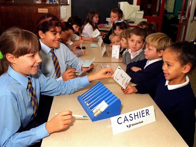 Pupils at Sandford Primary learned about money at the Yorkshire Bank school bank in November 1997.  Pictured is Laura Woodhead carrying out a transaction for Jordaine Kirk.
