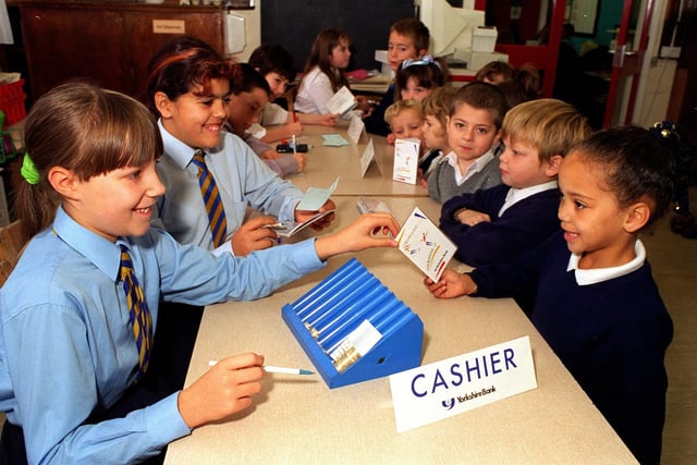 Pupils at Sandford Primary learned about money at the Yorkshire Bank school bank in November 1997.  Pictured is Laura Woodhead carrying out a transaction for Jordaine Kirk.