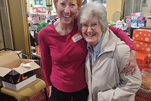 A volunteer with Jean Parker