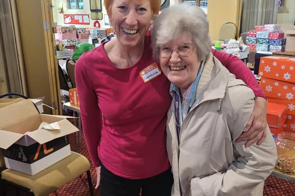 A volunteer with Jean Parker
