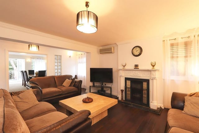 The lounge has a wood floor, real flame gas fire set in a feature fireplace, two radiators and opens to the dining room.