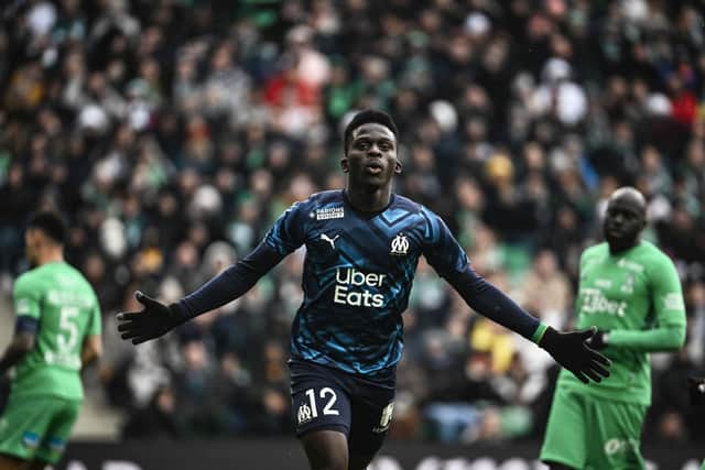 TOPSHOT - Marseilles Senegalese forward Bamba Dieng celebrates after scoring a goal during the French L1 football match between AS Saint-Etienne (ASSE) and Olympique de Marseille (OM) at Geoffroy Guichard stadium in Saint-Etienne, on April 3, 2022. (Photo by JEFF PACHOUD / AFP) (Photo by JEFF PACHOUD/AFP via Getty Images)
