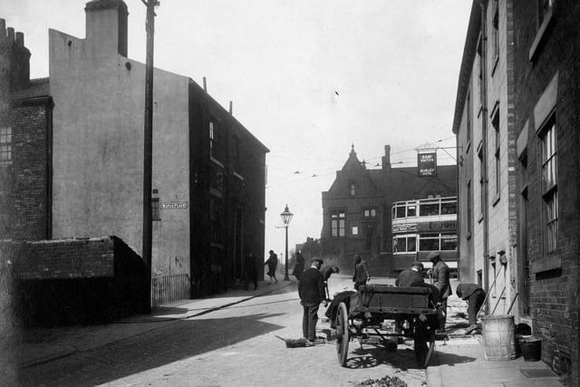 A view looking up Willow Road towards junction with Burley Road. Burley Lawn Council school behind iron railings on Burley Road can be seen. Burley Hotel is on right on corner of Willow Road. Entrance to Maple Rise is visible on the right. Pictured in April 1931.