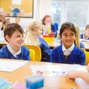 Teacher with two pupils in a classroom