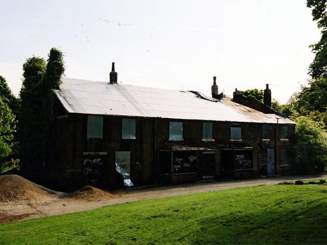 The derelict 'Top of the Wood' cottages in Middleton Park which, from 1920 until 1997, housed a cafe for visitors to the park. The cottages date from the early 18th Century and housed colliery workers employed by the owners of the estate and coalmines, the Brandling family.
