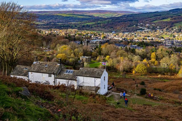 21 November 2021.....   Visitors to White Wells on Ilkley Moor in autumnal sunshine. Picture Tony Johnson