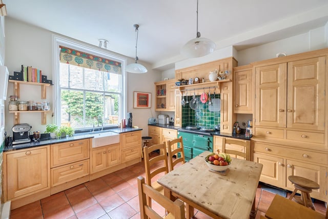 The kitchen features a gas fired Aga and has ample space for a dining table.