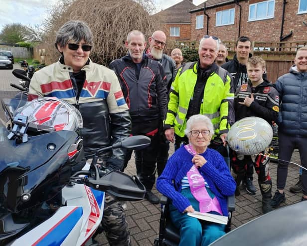 Betty Wood (front, centre) with bikers from the region on her 100th birthday.