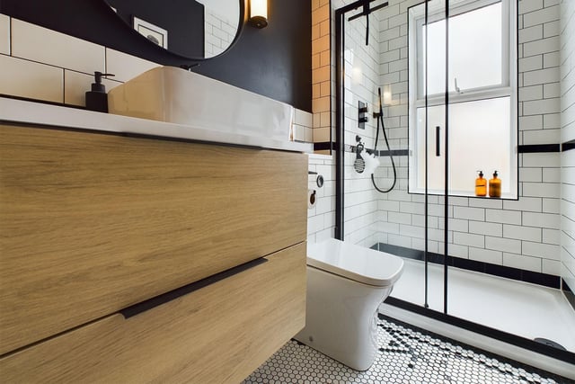 There is a modern shower room on the first floor, with waterfall shower and matt black contemporary fittings. The tasteful design blends modern with Victorian through mosaic penny floor tiles and metro wall tiles.