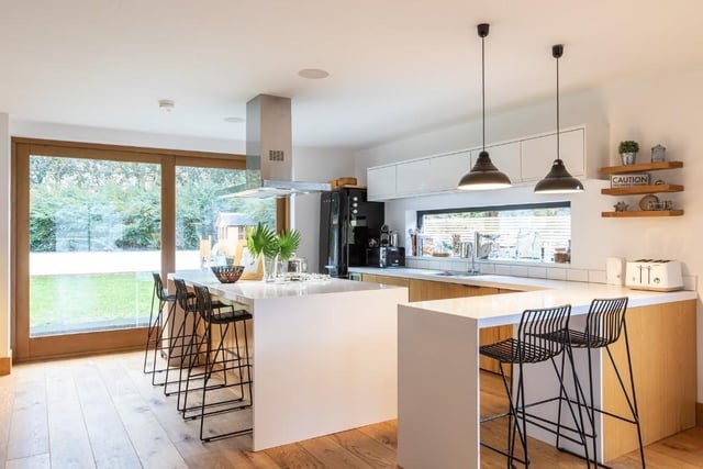 The breakfasting kitchen has solid wood units, Corian worktops and fitted Smeg appliances.