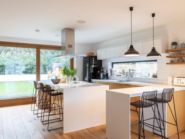 The breakfasting kitchen has solid wood units, Corian worktops and fitted Smeg appliances.
