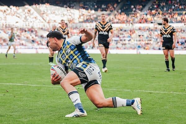 Rhyse Martin scores for Rhinos in the Magic Weekend loss to Castleford. Picture by Alex Whitehead/SWpix.com.