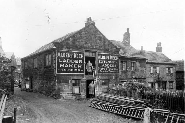 Premises of Albert Keep, ladder maker at number 88 Upper Wortley Road. Wall sign is advertising extension ladders, steps and trestles for all trades. Two men pose in the doorways, ladders are stacked outside. Pictured in August 1961.