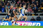 Leeds Rhinos winger Ash Handley outpaces the Salford Red Devls defence to score Super League's round one try of the week. Picture by Allan McKenzie/SWpix.com.